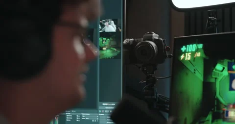 Young man playing video games and setting up a livestream Stock Footage 306199626