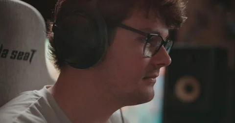 Young man playing video games and setting up a livestream Stock Footage 306199833