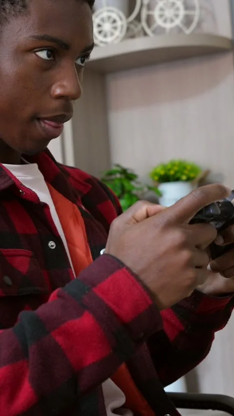 Young man playing videogames with controller and headphones Stock Footage 307290357