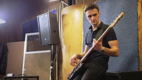 Young Man Playing a Vintage Looking Electric Guitar Stock Footage 72219937