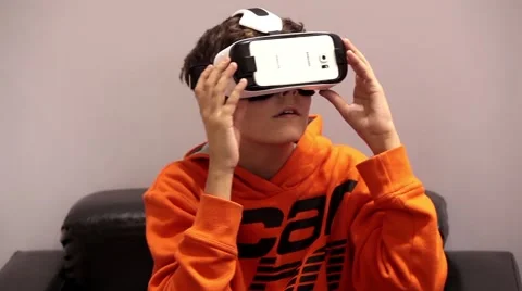 Young man playing with virtual reality glasses. Virtual reality game. Stock-Footage 55456817
