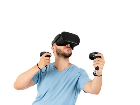 Young man playing with a virtual reality glasses on a white background Stock Photos