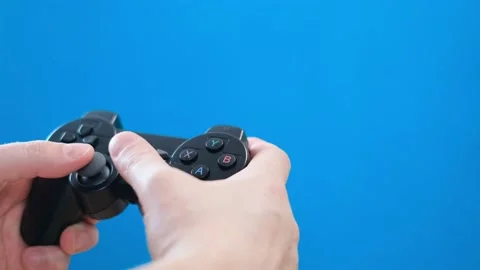 A young man plays a game console. Gamer and computer video games on chromakey Stock Footage 233895492