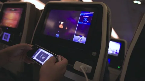 Young Man plays Game during Flight in Airplane. Stock Footage 235281339