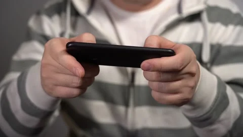 Young Man Plays On The Phone At Work. Video stock 150868414