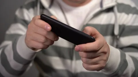 Young Man Plays On The Phone At Work. Stock Footage 166995818