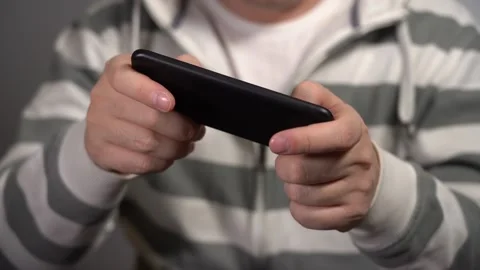 Young Man Plays On The Phone At Work. Stock Footage 167212528