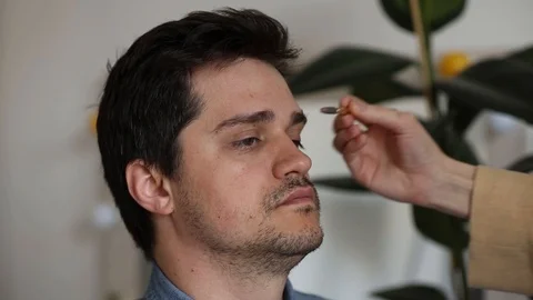 The young man plucked his eyebrows Stock Footage 107873403