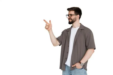Young man pointed side on adv on white background Stock-Fotos