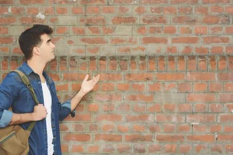 Young man pointing at copy space Stock Photos