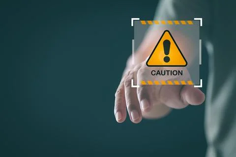 Young man pointing at exclamation mark icon, warning label concept, safety .. Stock Photos