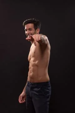 Young man pointing figer at camera looking Stock Photos