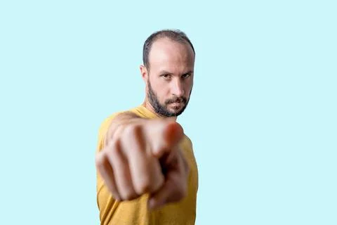 Young man pointing finger at camera with serious confident expression Foto stock