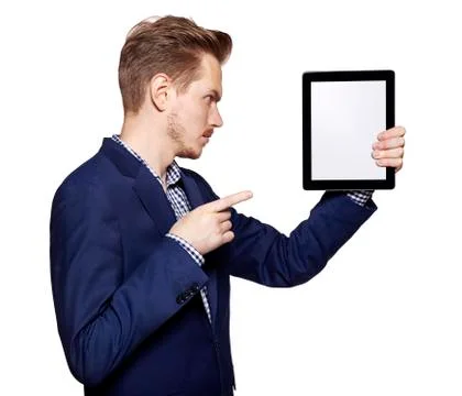Young man pointing at tablet PC Stock Photos
