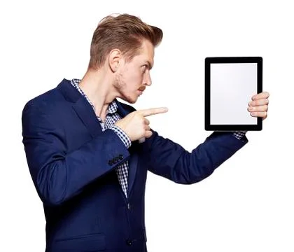 Young man pointing at tablet PC Foto stock