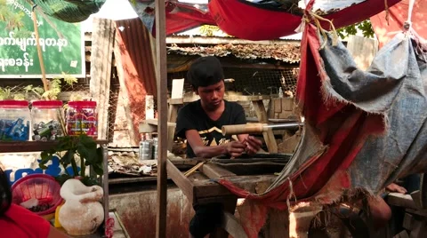 Young man polish jade on Machine near  market of Mandalay in Myanmar Stock Footage 61204471