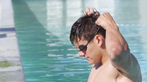 Young man at the pool Stock Footage 80134036