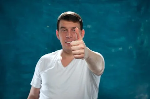 Young man posing on blue background Stock Photos