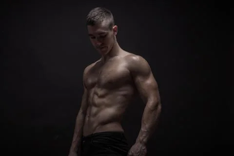 Young man posing, bodybuilder strong muscular Stock Photos