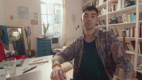 Young Man Posing on Camera at Desk with Laptop at Home Stock Footage 243207839