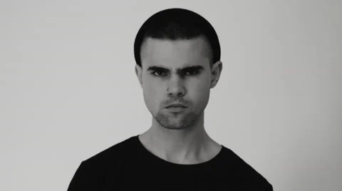 Young man posing for the camera in the studio Video stock 68408990
