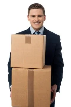 Young man posing with cardboard boxes Stock Photos