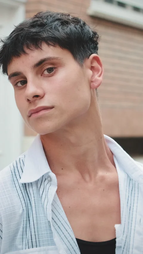 Young man posing looking at camera on the street Stock Footage 250843886