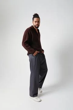 Young man posing over white background. Mind set and mental health. Vertical. Fotos de archivo