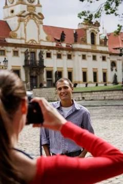 Young man posing for photo in front of building Stock Photos