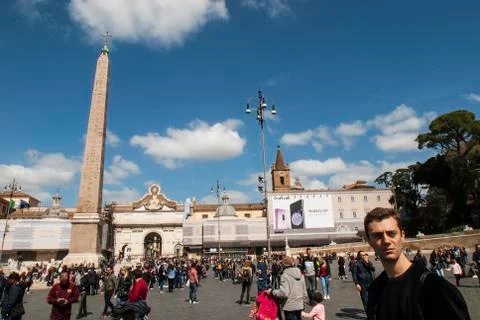 Young man posing at Piazza del Popolo and the Obelix of Ramesses II, Rome, Italy Stock Photos