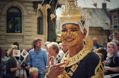 A young man posing for a picture at the pride parade Foto stock