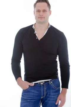 Young man posing sexy while wearing casual clothes Stock Photos