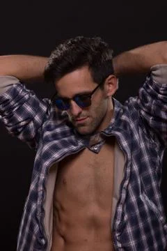 Young man posing sunglasses jacket body Stock Photos