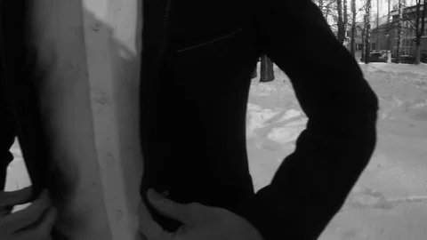Young man posing in a tuxedo in the winter against the white snow,shot in retro Stock Footage 85069889