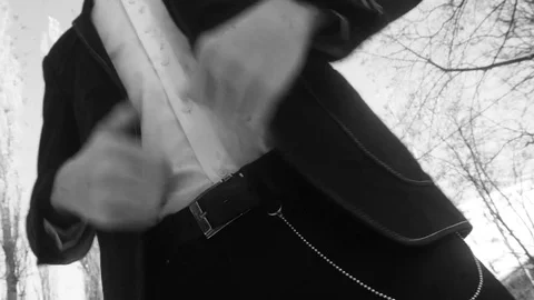 Young man posing in a tuxedo in the winter against the white snow,shot in retro Stock Footage 85070144