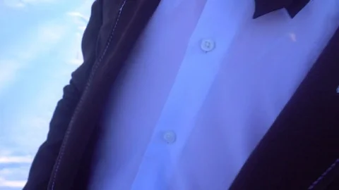 Young man posing in a tuxedo in the winter against the white snow Stock Footage 85138900