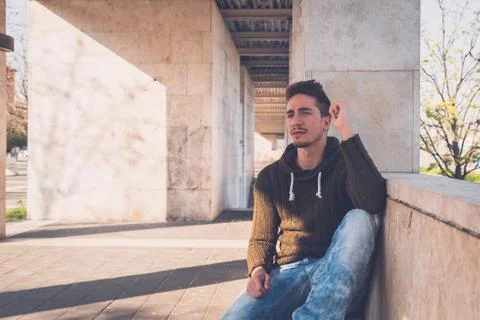 Young  man posing in an urban context Stock Photos