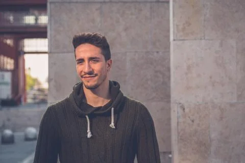 Young  man posing in an urban context Stock Photos