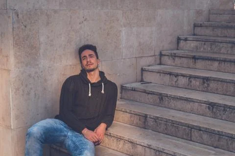 Young  man posing in an urban context Stock Photos