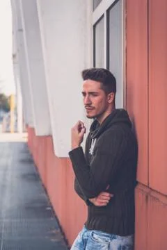 Young  man posing in an urban context Stock Photos