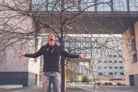 Young  man posing in an urban context Stock Photos