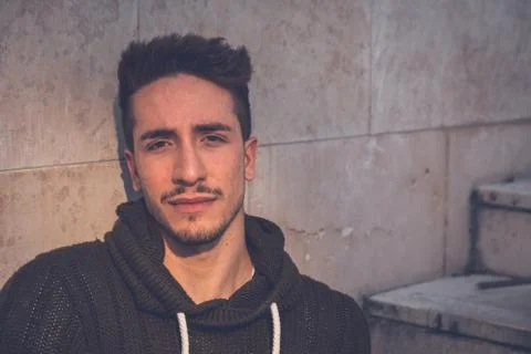 Young  man posing in an urban context Stock Photos