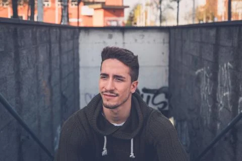 Young  man posing in an urban context Stock Photos