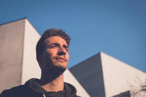 Young  man posing in an urban context Stock Photos