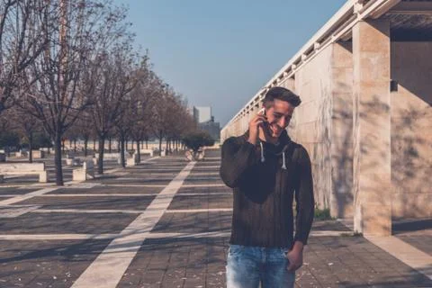Young  man posing in an urban context Stock Photos