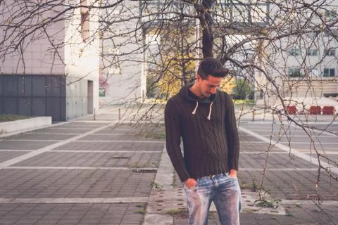 Young  man posing in an urban context Stock Photos
