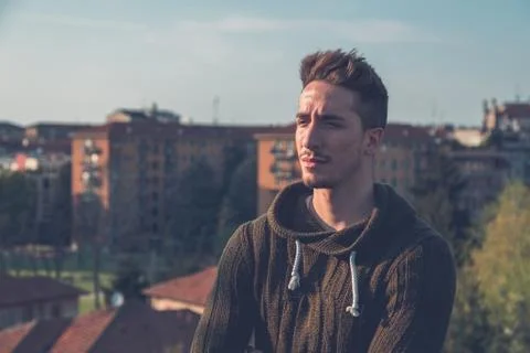Young  man posing in an urban context Stock Photos