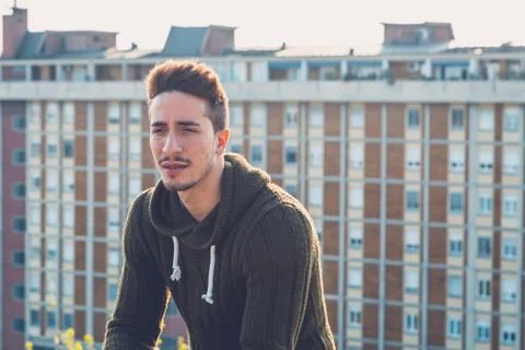 Young  man posing in an urban context Stock Photos