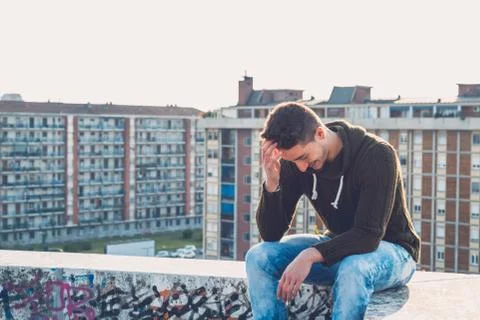 Young  man posing in an urban context Stock Photos