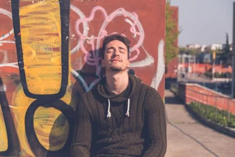 Young  man posing in an urban context Stock Photos